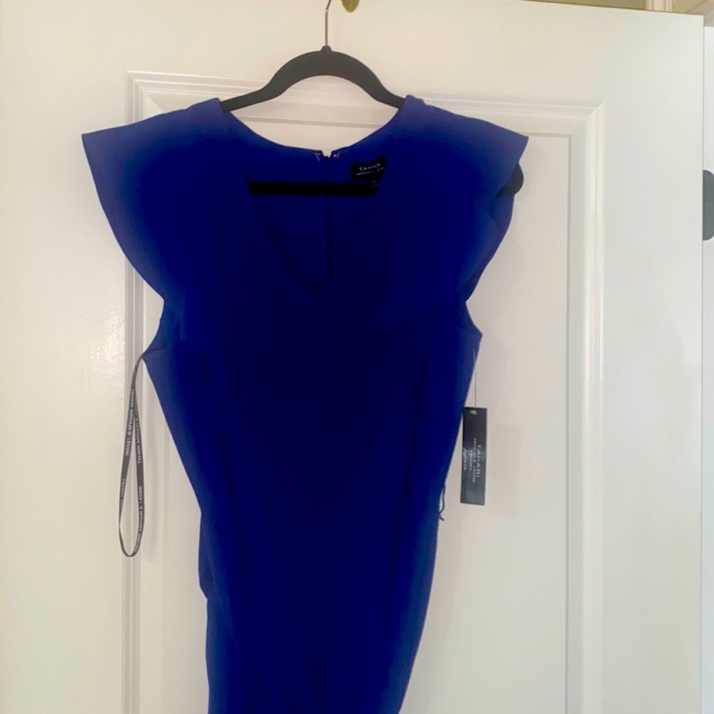 This sharp royal Blue jumpsuit is a must have. It's sexy and chic. Brand new!